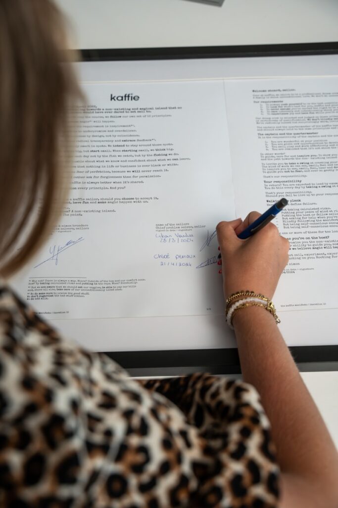 A woman writing on a piece of paper